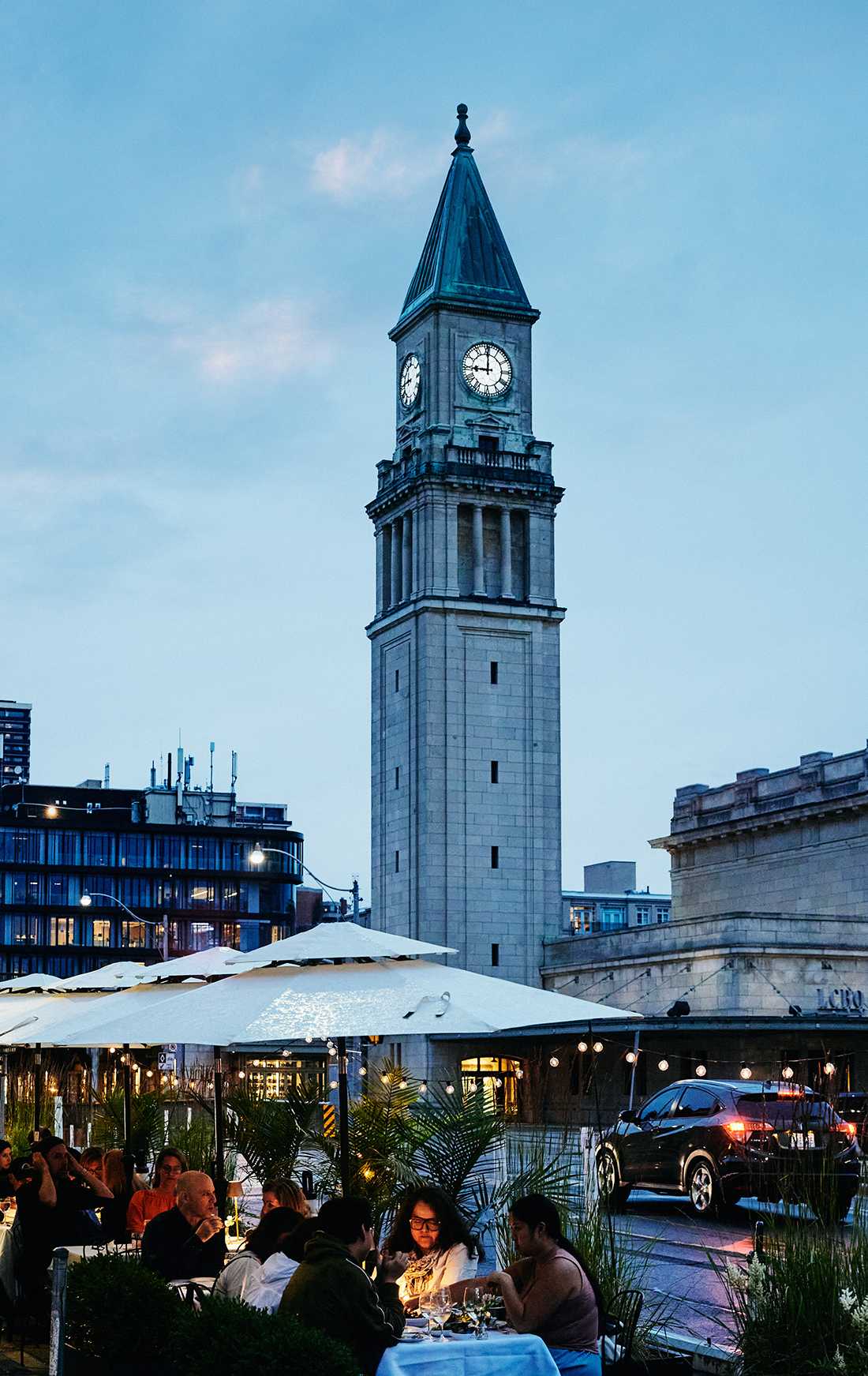 1 Roxborough West neighbourhood shot with clock tower in the background and vibrant Summerhill’s dine-in scene in foreground